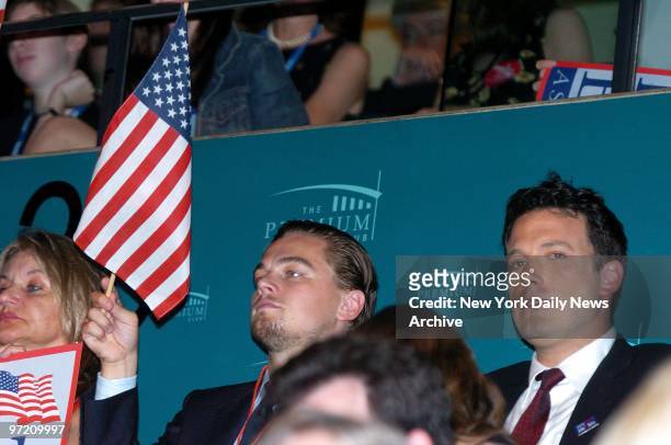 Actors Leonardo DiCaprio and Ben Affleck listen to speakers on the last day of the Democratic National Convention at Boston's FleetCenter.