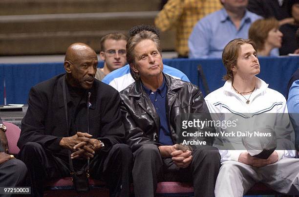 Actors Lou Gossett Jr., Michael Douglas and son Cameron Douglas watch as the New Jersey Nets defeat the Miami Heat, 97-78, at the Continental...