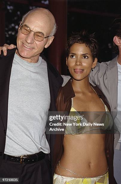 Actors Patrick Stewart and Halle Berry attend the premiere of the movie "X-Men" at Ellis Island. He plays the Dr. Xavier and she is 'Storm' in the...