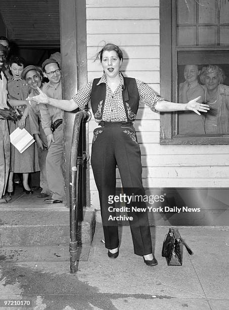 Actress Diana Barrymore registers dismay at her damaged living room, 450 E. 63rd St. Empty liquor bottles and beer cans attest to drinking bout. John...
