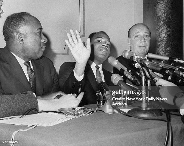 Air Force Major James C. Meredith, with his cousin James Meredith, waved off questioning during a press conference in the Oval Room of the Hotel...