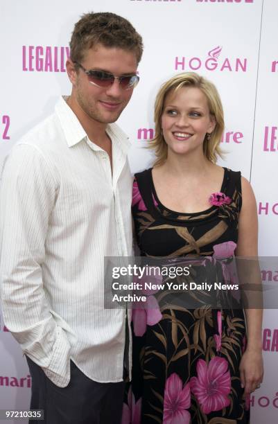 Actress Reese Witherspoon is joined by her husband, Ryan Phillippe, at the opening of her movie, "Legally Blonde 2: Red, White & Blonde," at the...