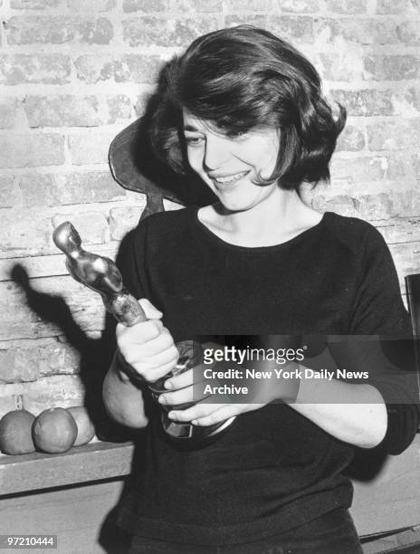 Actress Anne Bancroft clutches Oscar she won for performance in "The Miracle Worker."