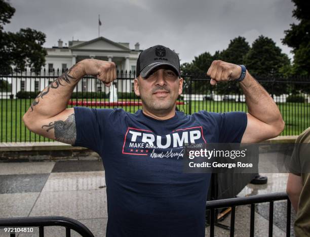 Man wearing a Trump t-shirt poses in front of The White House on June 3, 2018 in Washington, D.C. The nation's capital, the sixth largest...