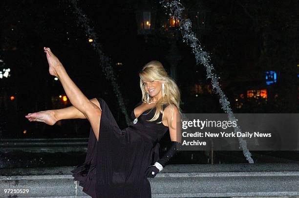 Actress Savanna Samson perches on the edge of the Jacob Wrey Mould Fountain during filming of a scene from the adult film "La Dolce Vita" at City...