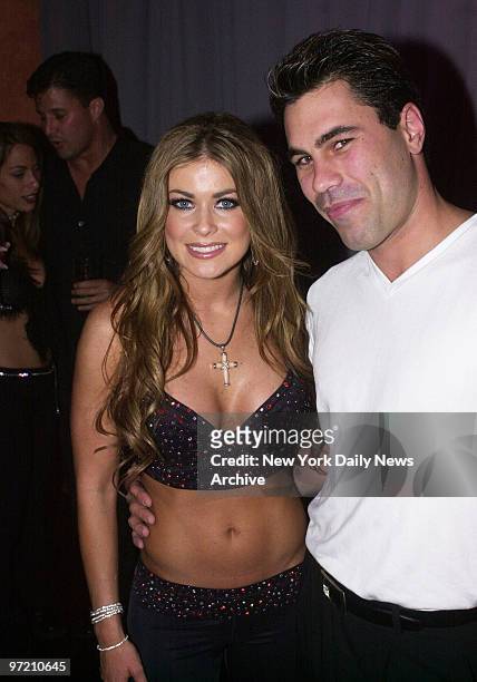 Actress Carmen Electra is joined by Sean Lewis at a club in South Beach, Miami.