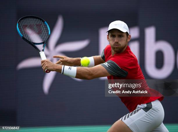 Kevin King of the USA competes in his men's singles match against Bernard Tomic of Australia during day two of the 2018 Libema Open on June 12, 2018...