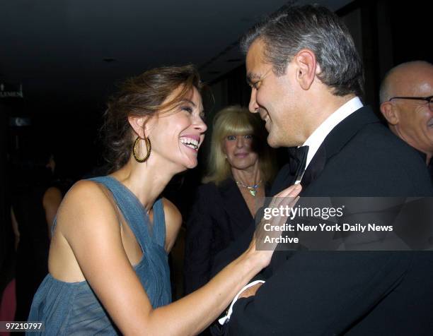 Actress Teri Hatcher of "Desperate Housewives" has an animated conversation with actor George Clooney at Lincoln Center's Avery Fisher Hall before...