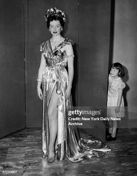 Actress Deborah Kerr wearing a Raoul Pene du Bois gown that she wore as the Queen of the Art Students League's Dream Ball as her daughter, Melanie,...