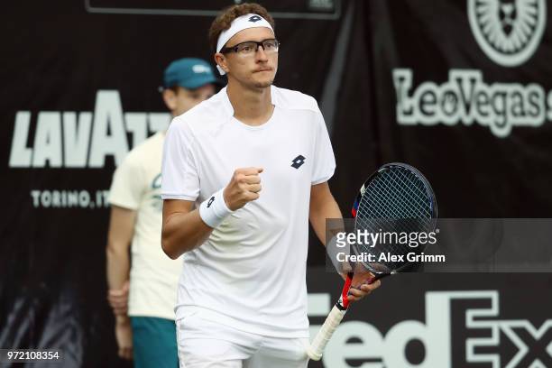 Denis Istomin of Uzbekistan celebrates after winning his match against Philipp Kohlschreiber of Germany during day 2 of the Mercedes Cup at...