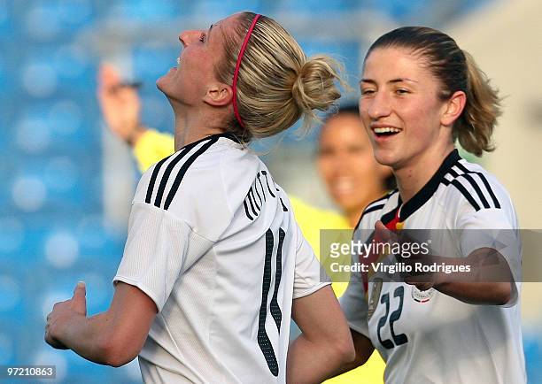 Anja Mittag and Bianca Schmidt of Germany celebrate the goal during the Woman Algarve Cup match between Germany and China at the Estadio Algarve on...