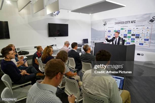 Manager Graham Potter speaks to reporters during the Swansea City Press Conference at The Fairwood Training Ground on June 12, 2018 in Swansea, Wales.