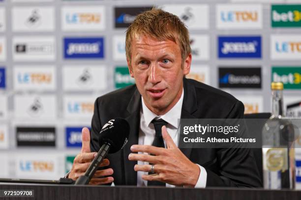 Manager Graham Potter speaks to reporters during the Swansea City Press Conference at The Fairwood Training Ground on June 12, 2018 in Swansea, Wales.