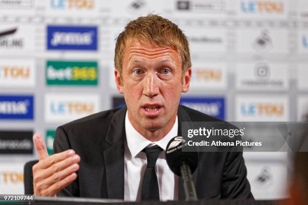 Manager Graham Potter speaks to reporters during the Swansea City Press Conference at The Fairwood Training Ground on June 12, 2018 in Swansea, Wales.