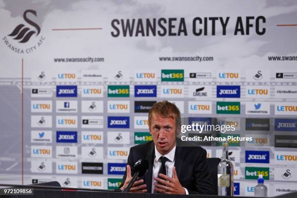 Manager Graham Potter speaks to reporters during the Swansea City Press Conference at The Fairwood Training Ground on June 12, 2018 in Swansea, Wales.