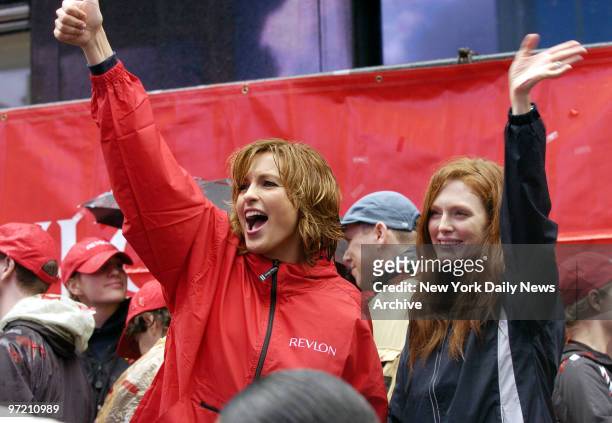 Actresses Mariska Hargitay and Julianne Moore wave encouragement to thousands of runners before the start of the eighth annual Revlon Run/Walk For...