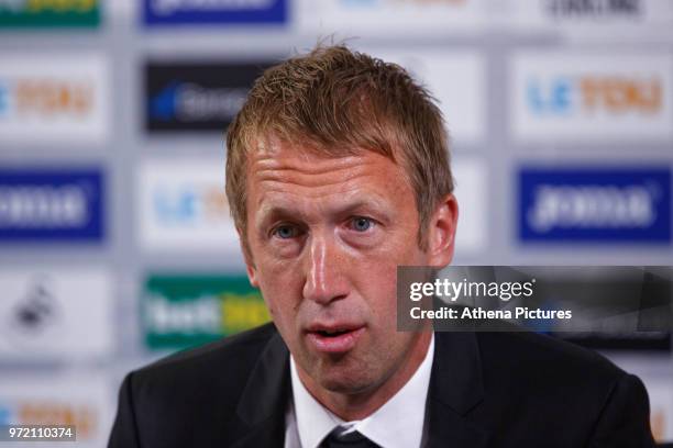 Manager Graham Potter speaks to reporters during the Swansea City Press Conference at The Fairwood Training Ground on June 12, 2018 in Swansea, Wales.