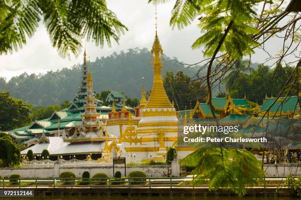 The twin temples by the lake in the centre of Mae Hong Son, Wat Chong Kham has Burmese style temple building and Wat Chong Klang houses the white and...