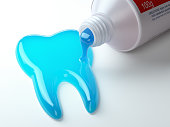 Toothpaste in the shape of tooth coming out from toothpaste tube. Brushing teeth dental concept.