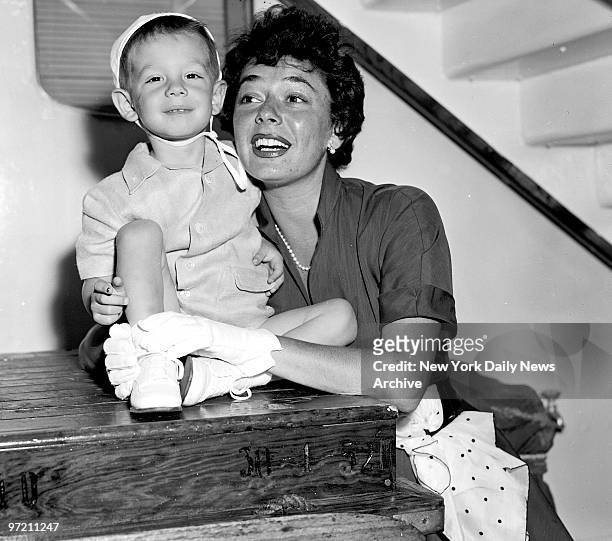 Actress Ruth Roman and her son, Richard get an eyeful of the scenery as they arrive aboard the Italian liner Andrea Doria at Pier 84. Ruth, wife of...