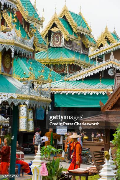 Detail of one of the twin temples by the lake in the centre of Mae Hong Son, Wat Chong Klang which hosts the white and gold chedi or Buddhist stupa.