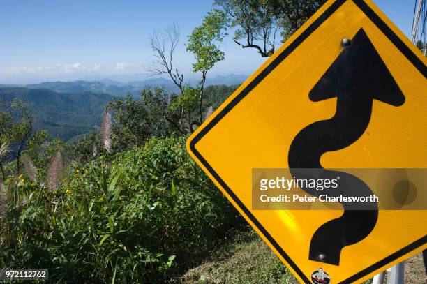 Very windy road signs by the side of the mountain road heading towards Mae Hong Son.