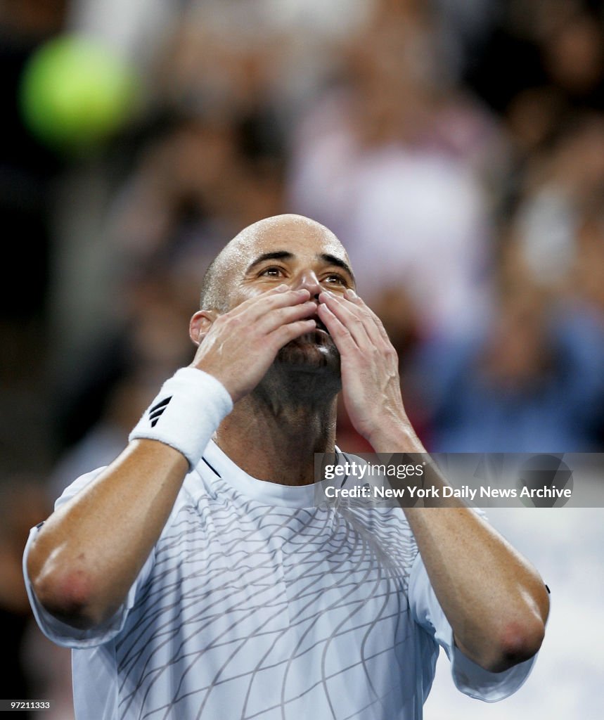 Andre Agassi of the U.S. blows kisses to the crowd after def
