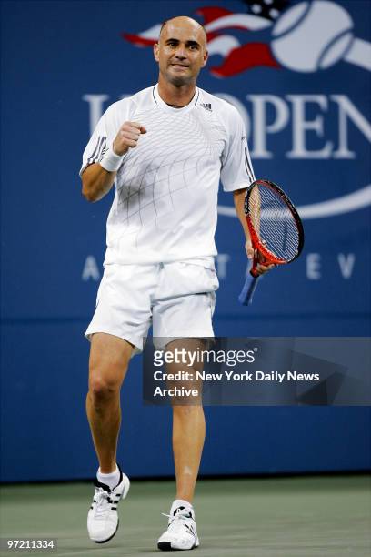 Andre Agassi of the U.S. Celebrates after breaking a serve in the second set against Marcos Baghdatis of Cyprus during the second round of the U.S....
