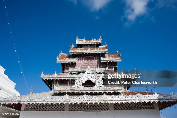 Detail of the Burmese style roof of a temple building in the Wat Phra That Doi Kong Mu temple compound overlooking Mae Hong Son.