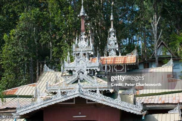 Detail of the Burmese style roof of a temple building in the Wat Phra That Doi Kong Mu temple compound overlooking Mae Hong Son.