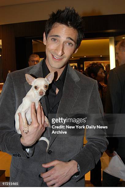 Adrien Brody has his girlfriend's pup as company at the opening of the Ermenegildo Zegna flagship store on Fifth Ave.