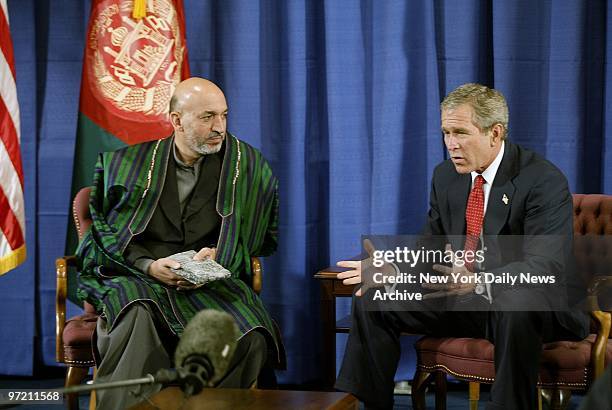 Afghan President Hamid Karzai meets President George W. Bush at the United Nations today. ,