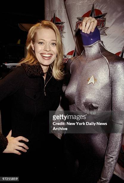 Actress Jeri Ryan, star of the television series "Star Trek Voyager," presenting costume she wears on show at the Fashion Cafe.