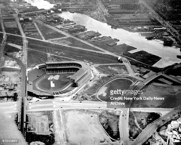 Aerial view of brand-new Yankee Stadium in 1923 shows empty spaces that will soon grow into busting South Bronx around the new ballpark.