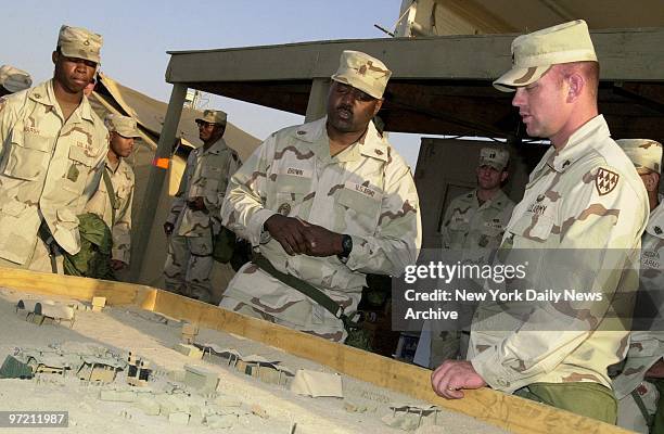 Army Command Sgt. Major Dwight Brown , the top adviser on enlisted personnel to Gen. Tommy Franks, visits a Patriot anti-missile crew, on duty near...