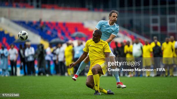 Rahdi Jaidi of CAF competes with Nuno Gomes of OFC at CSKA Arena during the on June 12, 2018 in Moscow, Russia.