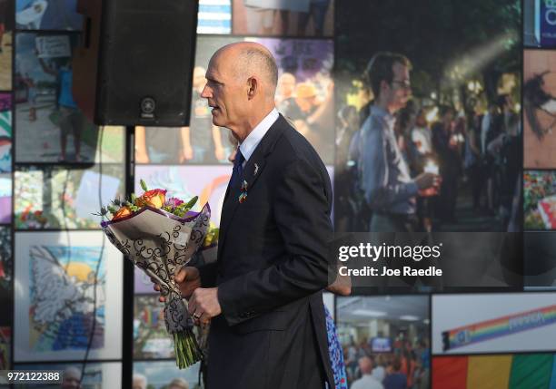 Florida Governor Rick Scott visits the memorial to the 49 shooting victims setup at the Pulse nightclub where the shootings took place two years ago...
