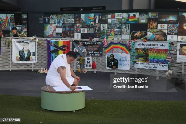 Jim McDermott visits the memorial to the 49 shooting victims setup at the Pulse nightclub where the shootings took place two years ago on June 12,...