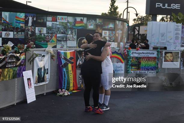Jordyn Victoria hugs Jim McDermott as they visit the memorial to the 49 shooting victims setup at the Pulse nightclub where the shootings took place...