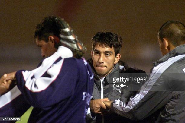 Paraguayan soccer players Nelson Cuevas and Roberto Acuna strech 27 March 2001 in the Centenario Stadium in Montevideo, Uruguay. El paraguayo Nelson...