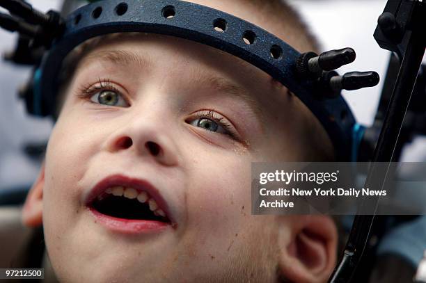 Aidan Fraser beams as he's wheeled out of Montefiore Medical Center on a gurney after a 20-day stay following spinal surgery. Fraser, whose father...