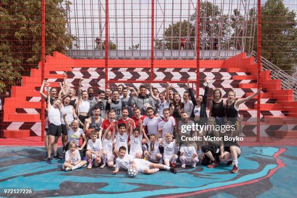 Ronaldo poses with Moscow youngsters at the opening of Box MSK at Gorky Park on June 12, 2018 in Moscow, Russia. Brazil football icon Ronaldo and...