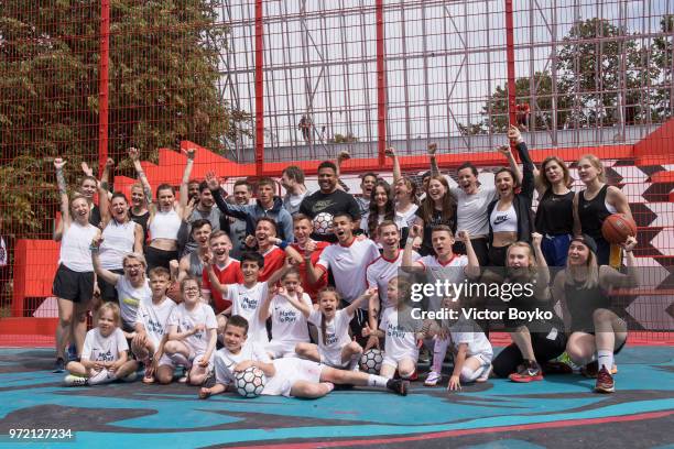 Andrey Arshavin, Ronaldo and Evgenia Medvedeva pose with Moscow youngsters at the opening of Box MSK at Gorky Park on June 12, 2018 in Moscow,...