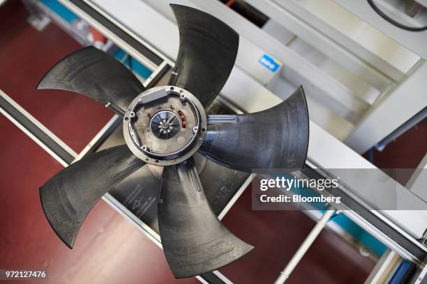 Blades sit on an air conditioning fan on the assembly line at the EBM-Papst GmbH ventilation systems factory in Mulfingen, Germany, on Tuesday, May...