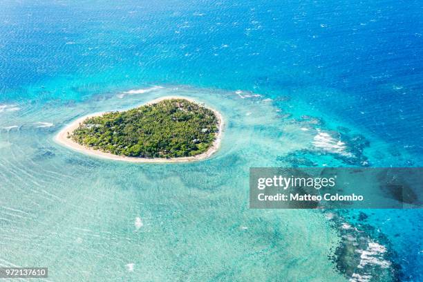 aerial view of tavarua, heart shaped island, mamanucas, fiji - fiji stockfoto's en -beelden