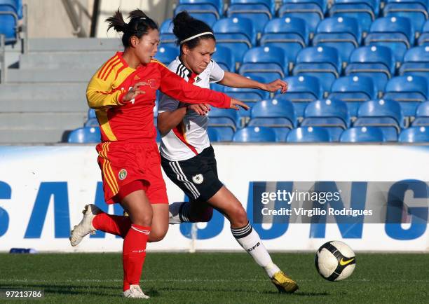 Celia Mbabi of Germany and Li Danyang of China battle for the ball during the Woman Algarve Cup match between Germany and China at the Estadio...