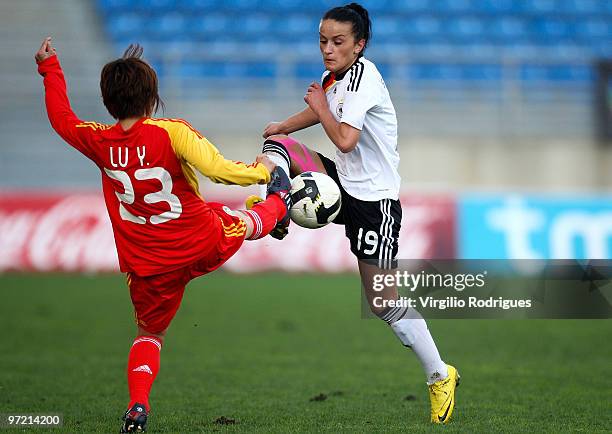 Fatmire Bajramal of Germany and Lu Yuan of China battle for the ball during the Woman Algarve Cup match between Germany and China at the Estadio...