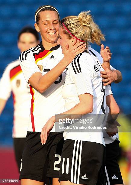 Anja Mittag and Lena Goebling of Germany celebrate the goal during the Woman Algarve Cup match between Germany and China at the Estadio Algarve on...