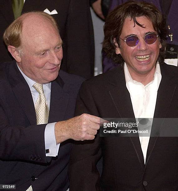 European Commission Vice President Neil Kinnock and Jean Michel Jarre share a joke during the International Federation of Phonographic Industries...
