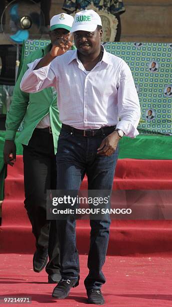 Togo�s outgoing president Faure Gnassingbe, son of general Gnassingbe Eyadema and candidate of Rassemblement du Peuple Togolais greets supporters...